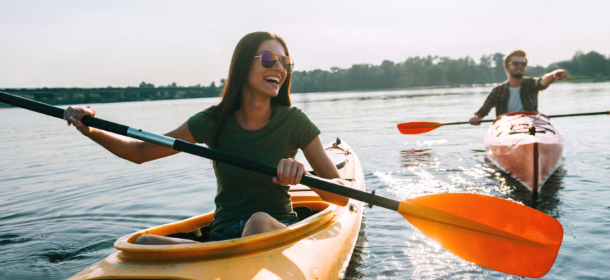 Couple,Kayaking,Together.,Beautiful,Young,Couple,Kayaking,On,Lake,Together